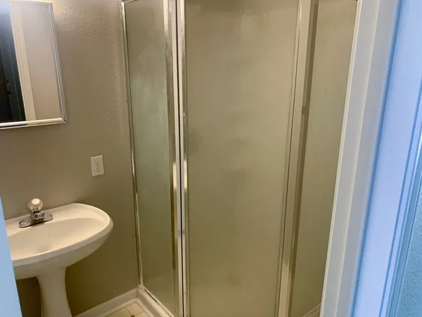 a bathroom with a sink and mirror