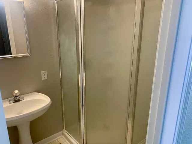 a bathroom with a sink and mirror