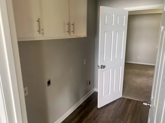 an empty room with wooden floor