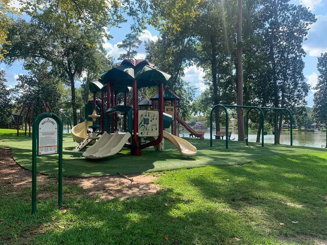 a view of a park with iron fence