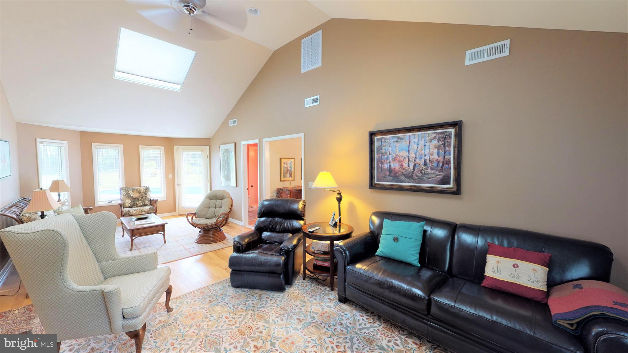 25972 Goose Neck Road Royal Oak, MD 21662 - Photo 25 of 58 Family room with cathedral ceiling & ceiling fan