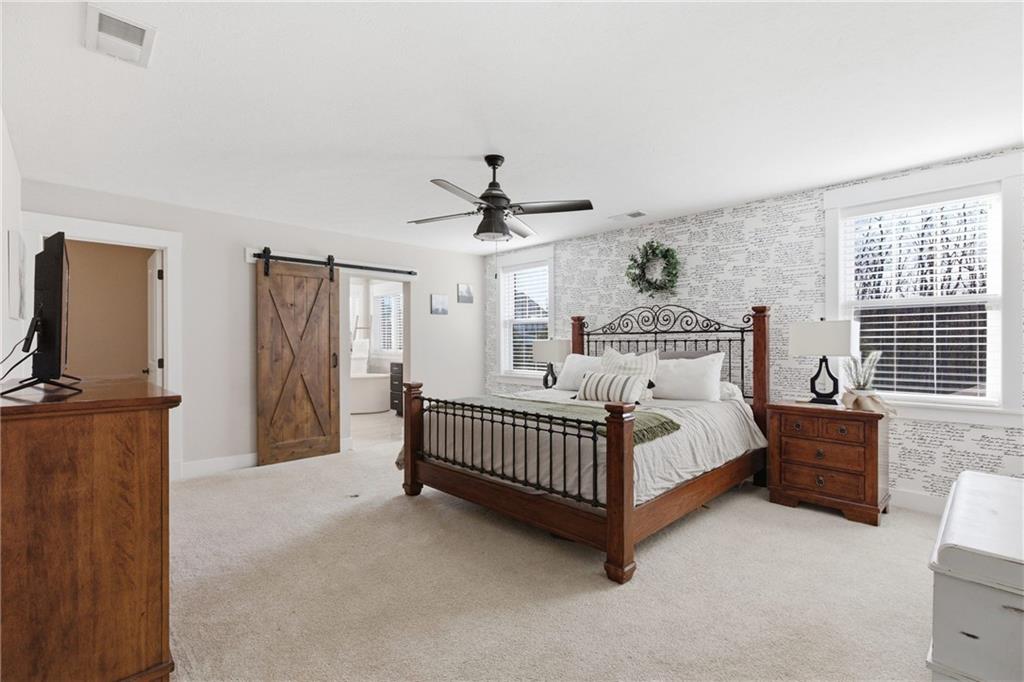 159 Davidson Road Mars, PA 16046 - Photo 30 of 50 a spacious bedroom with a bed and a chandelier