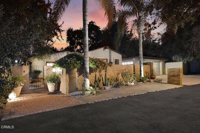 a view of a back yard of the house