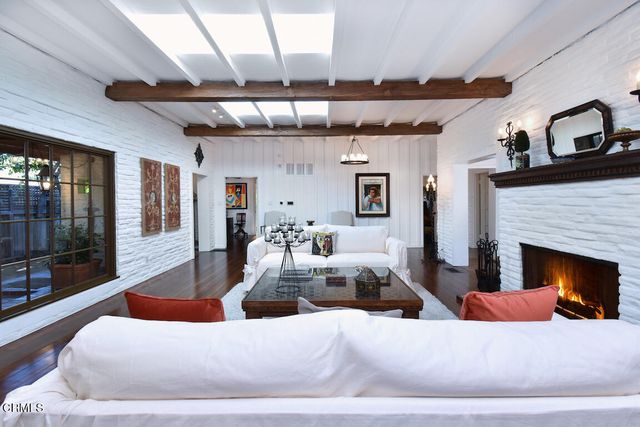 a bathroom with a bathtub and a window