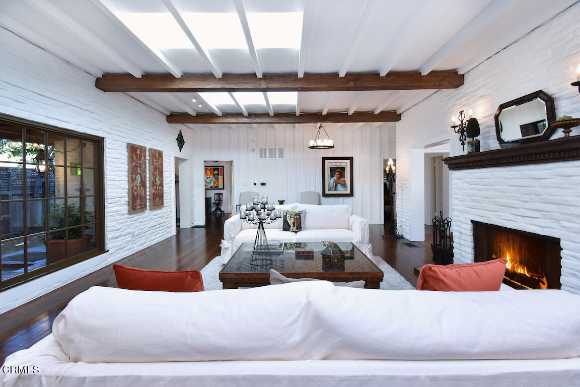 4727 Libbit Avenue Encino, CA 91436 - Photo 13 of 47 a living room with furniture and a fireplace
