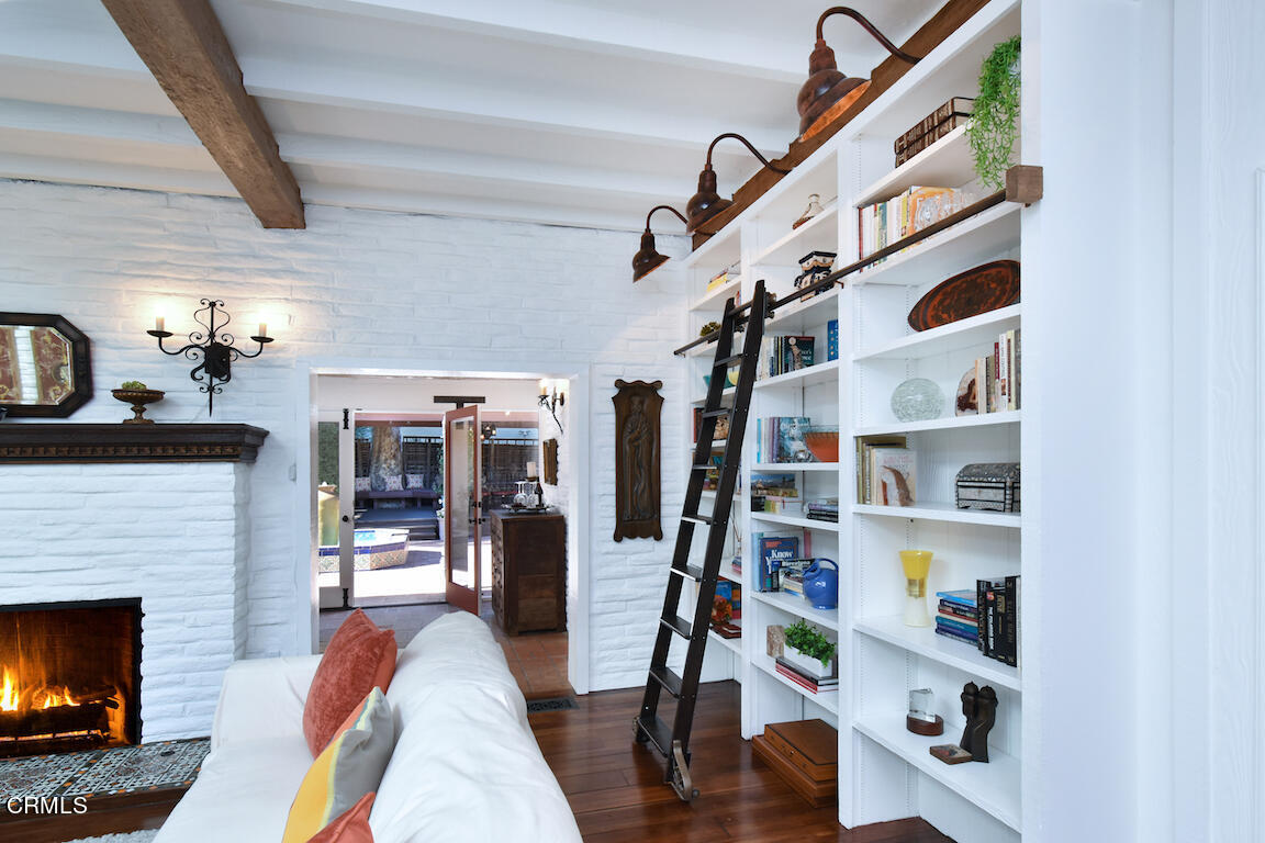 4727 Libbit Avenue Encino, CA 91436 - Photo 14 of 47 a living room with lots of furniture and a fireplace