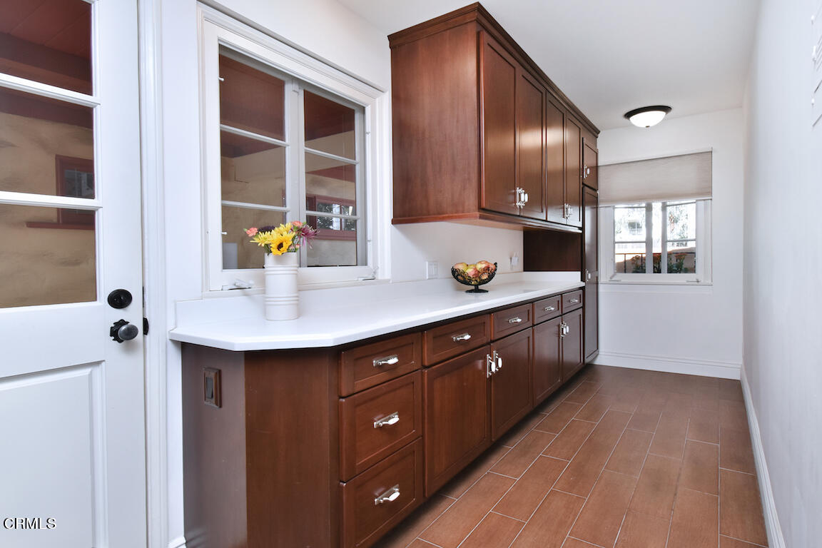 4727 Libbit Avenue Encino, CA 91436 - Photo 30 of 47 a kitchen with stainless steel appliances granite countertop a sink counter space cabinets and a window