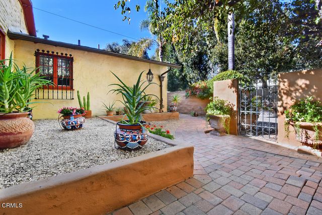 a living room with lots of furniture and a fireplace