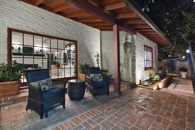 a kitchen with stainless steel appliances kitchen island granite countertop a refrigerator and a stove top oven