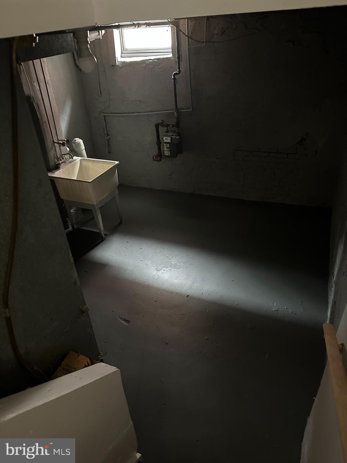 1707 North Dallas Street Baltimore, MD 21213 - Photo 10 of 12 a bathroom with a sink and mirror