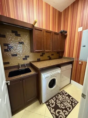 a kitchen with a stove and a microwave