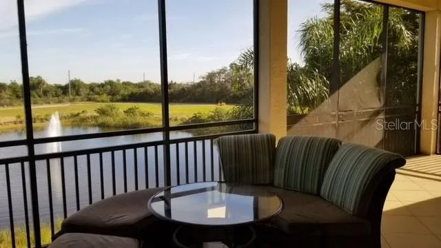 a view of a balcony with a table and chairs