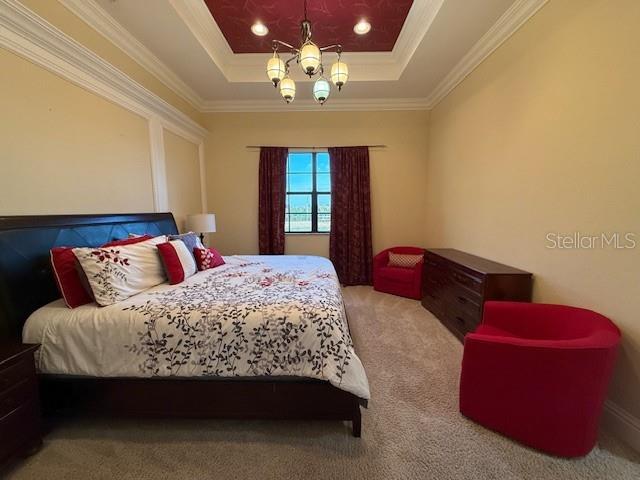 5508 Summit Pointe Circle, Unit 104 Bradenton, FL 34210 - Photo 7 of 19 a bedroom with a bed couch and window
