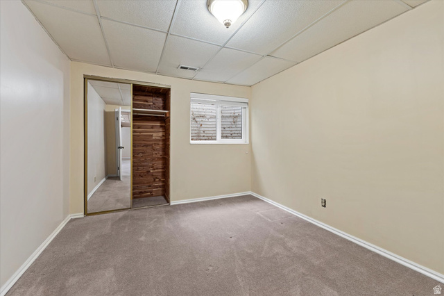 888 East 6895 South Midvale, UT 84047 - Photo 41 of 54 Functional bedroom with built-in cedar closet space and natural light from a window, enhancing everyday livability.