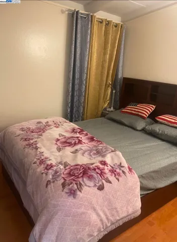 a bedroom with a bed and a cabinets