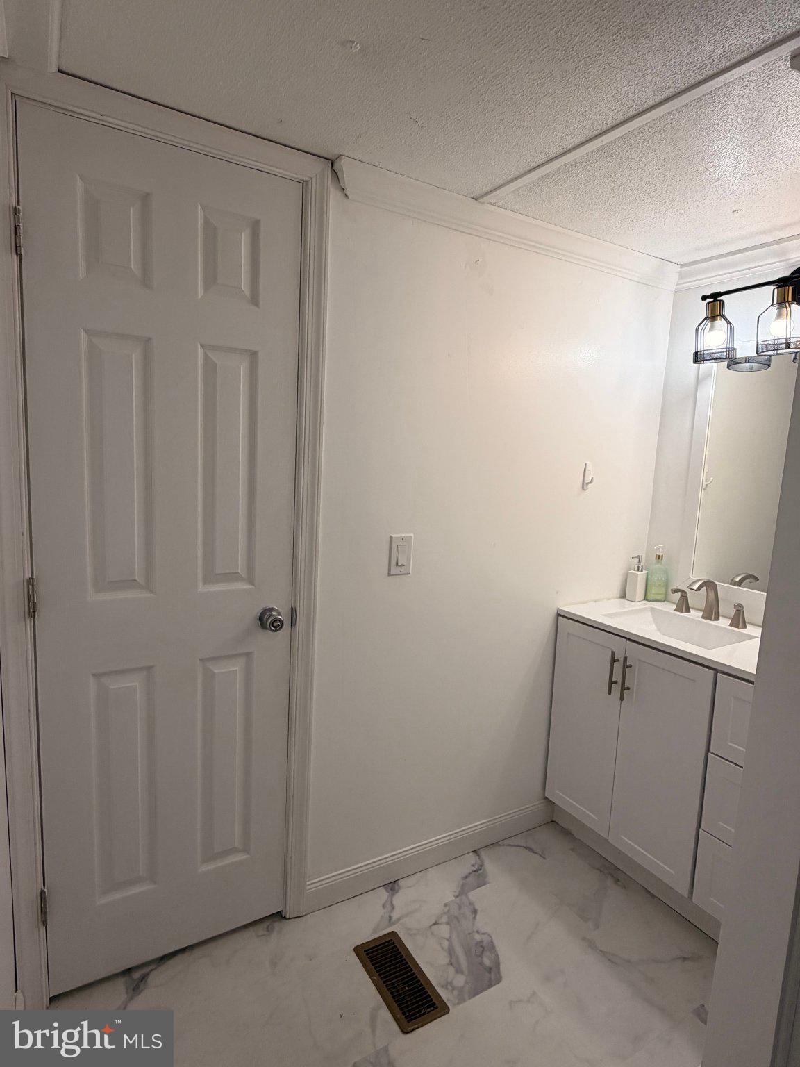 24 Carpenter Street, Unit 24 Dover, DE 19901 - Photo 9 of 27 Modern bathroom with sleek finishes.