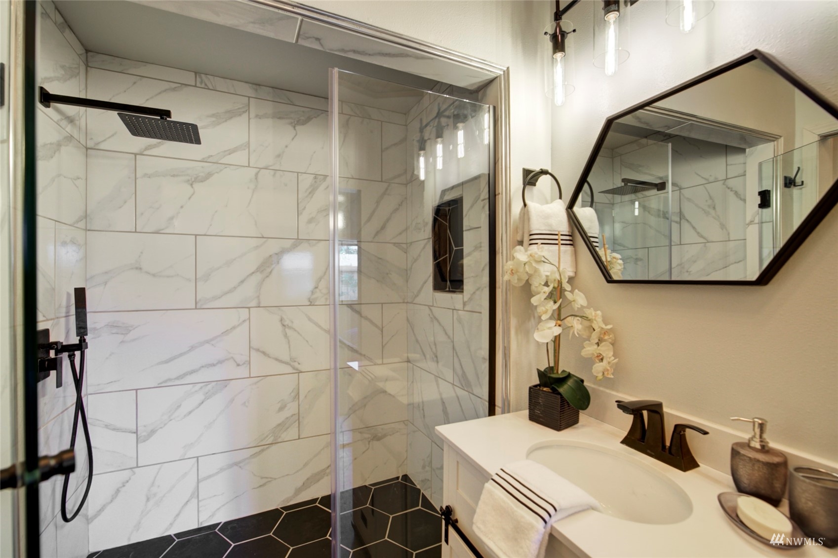 3612 Northeast 9th Street Renton, WA 98056 - Photo 18 of 23 a bathroom with a sink toilet and shower