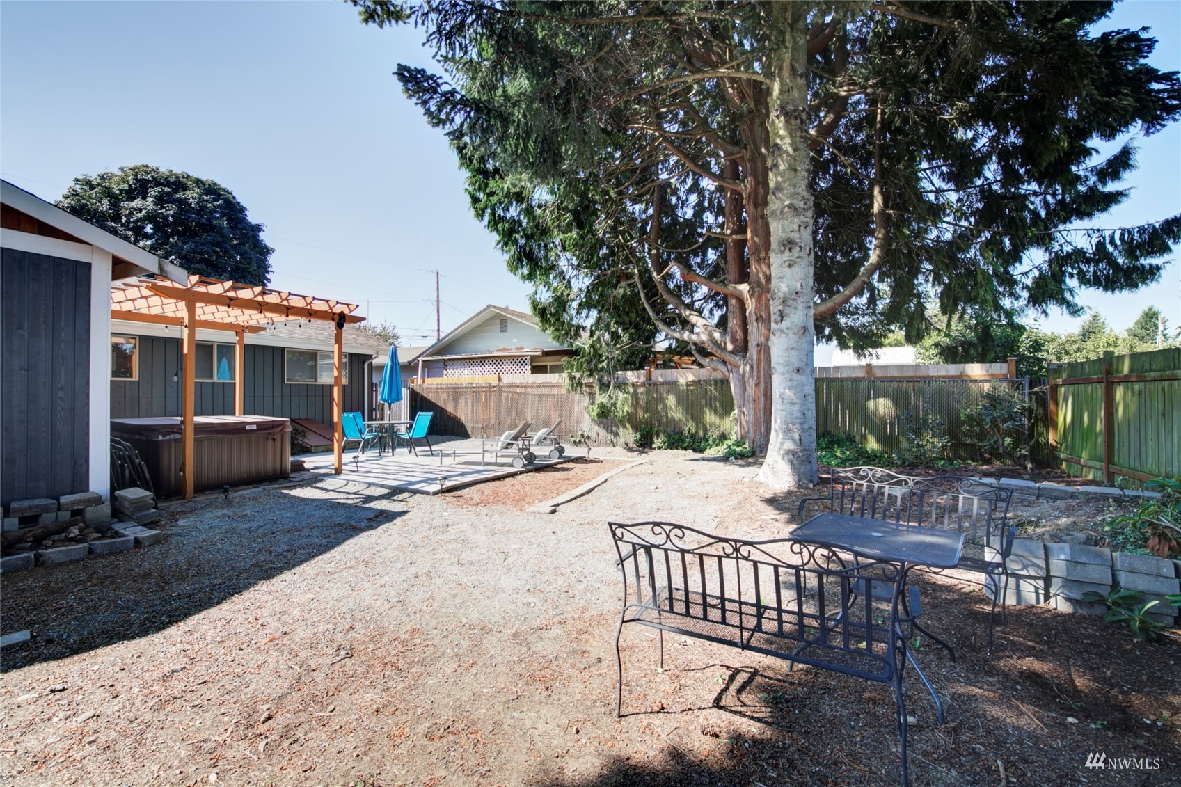 3612 Northeast 9th Street Renton, WA 98056 - Photo 22 of 23 a view of a patio with a table and chairs and potted plants