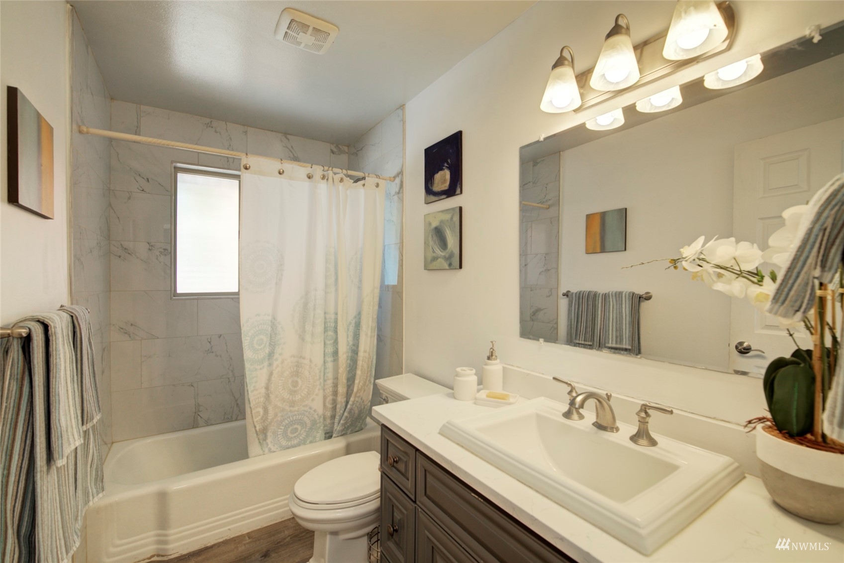 3612 Northeast 9th Street Renton, WA 98056 - Photo 6 of 23 a bathroom with a sink a toilet and shower