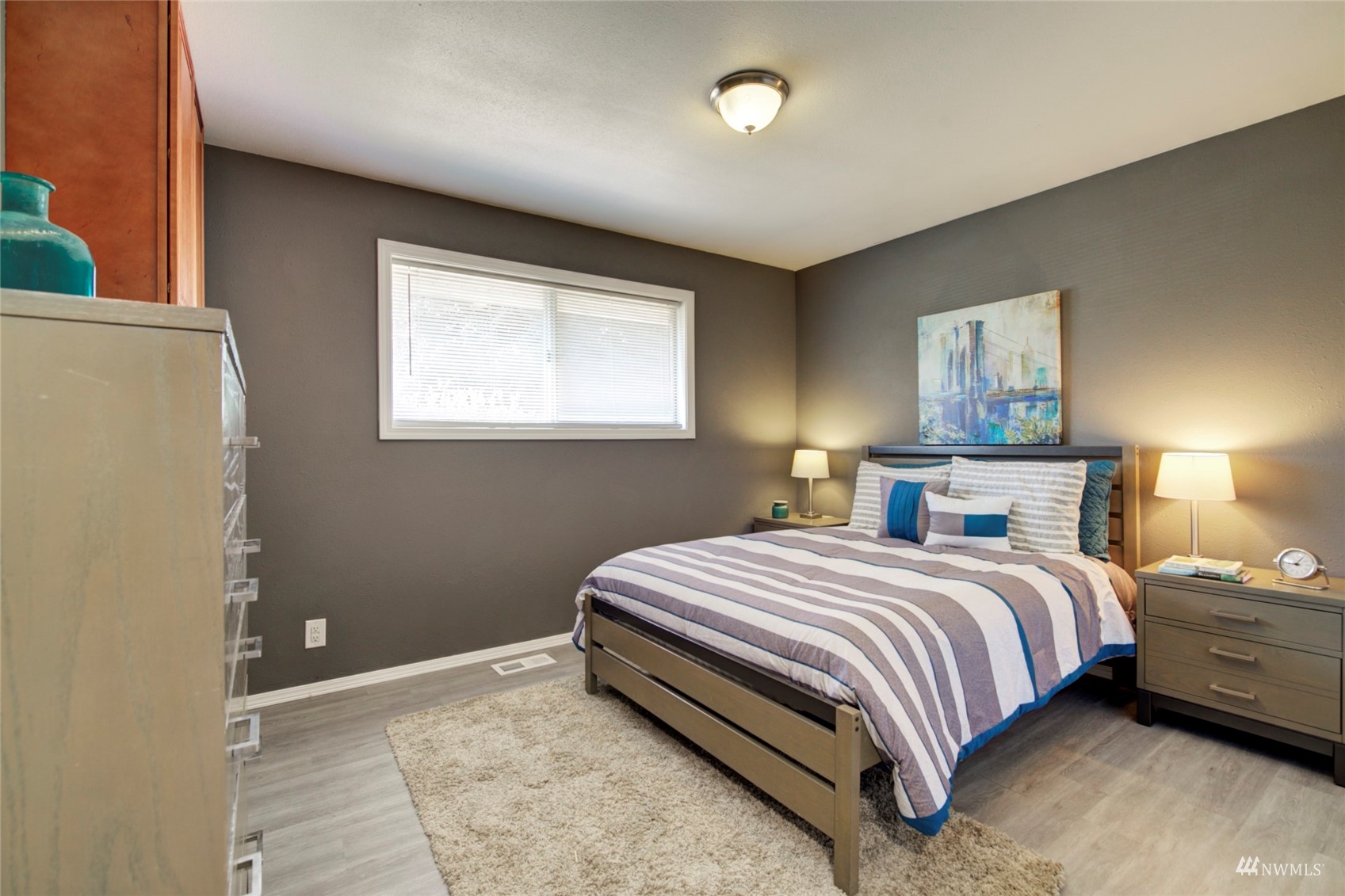 3612 Northeast 9th Street Renton, WA 98056 - Photo 8 of 23 a bedroom with a bed and window