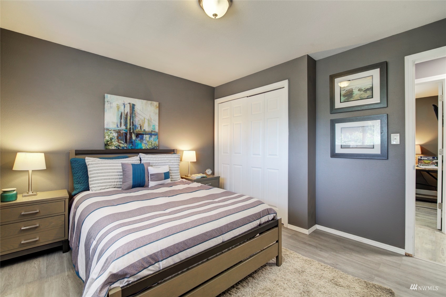 3612 Northeast 9th Street Renton, WA 98056 - Photo 9 of 23 a bedroom with a bed and a painting