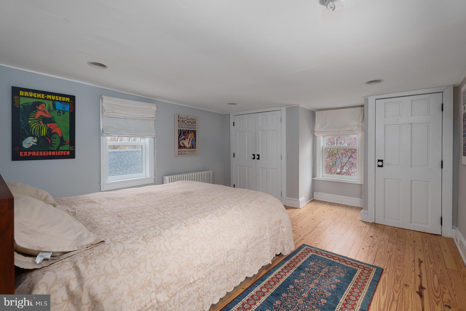 29 Chestnut Street Princeton, NJ 08542 - Photo 12 of 26 a spacious bedroom with a bed and a window