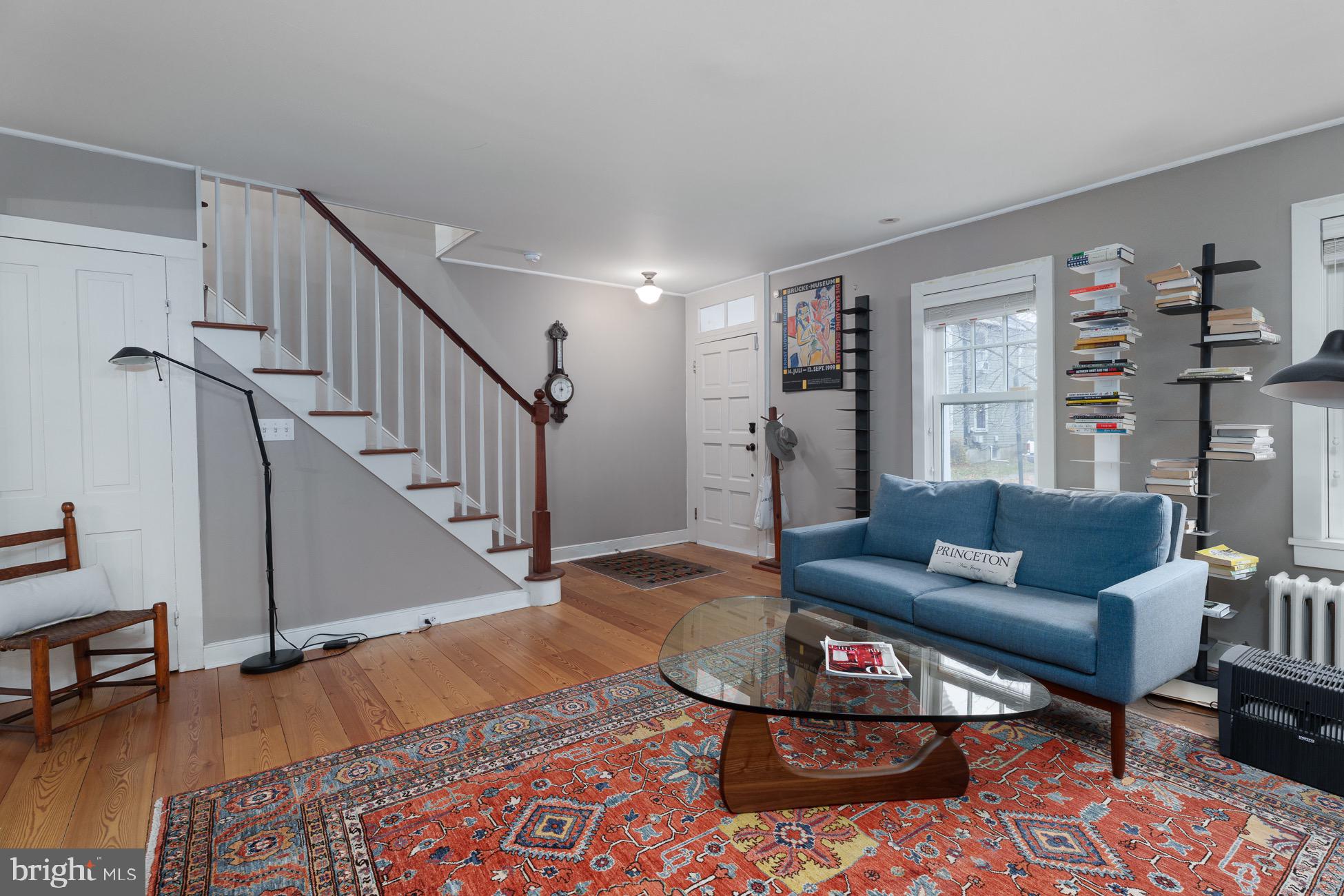 29 Chestnut Street Princeton, NJ 08542 - Photo 2 of 26 a living room with furniture and a dining table with wooden floor