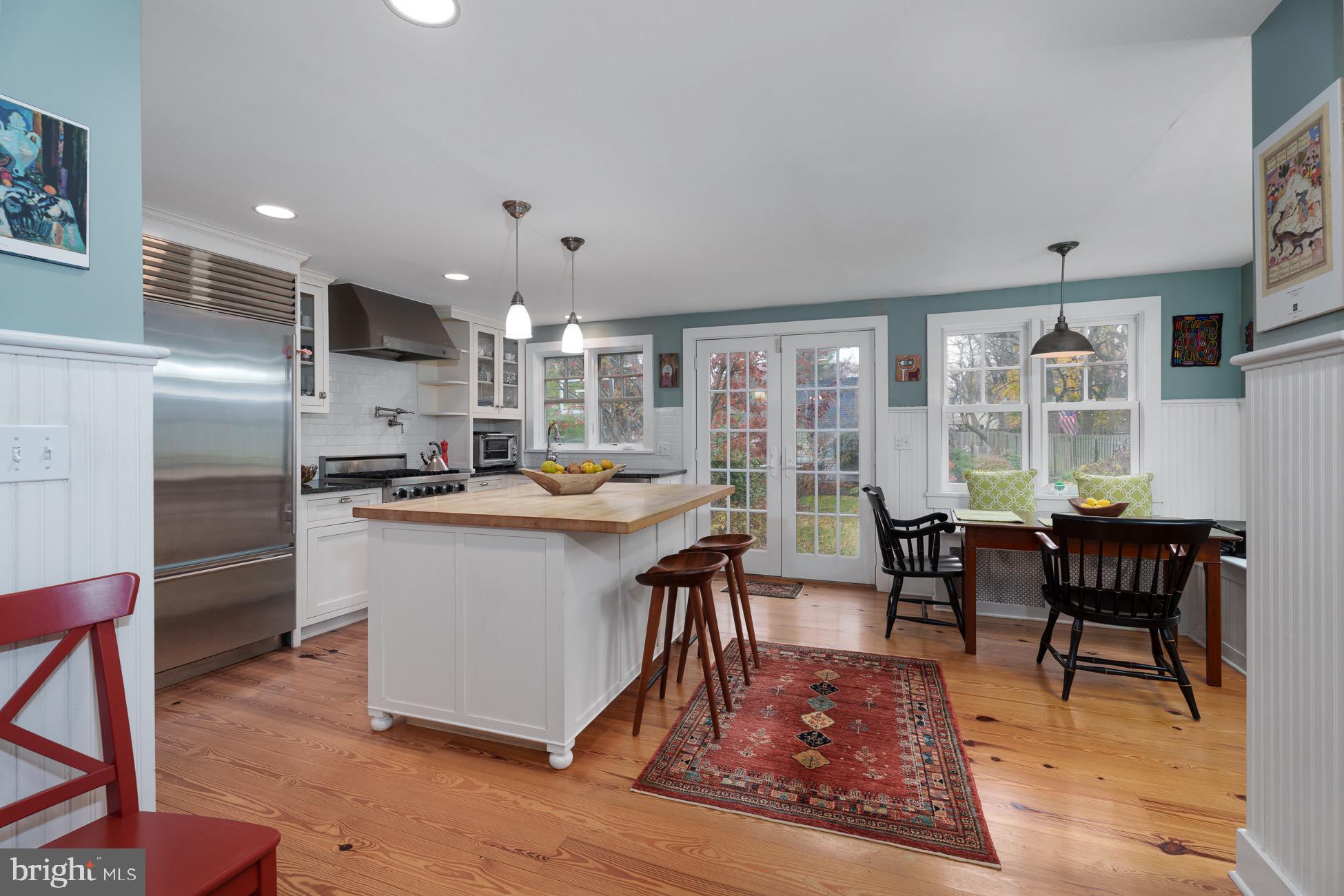 29 Chestnut Street Princeton, NJ 08542 - Photo 7 of 26 a living room with stainless steel appliances kitchen island granite countertop furniture wooden floor and a kitchen view