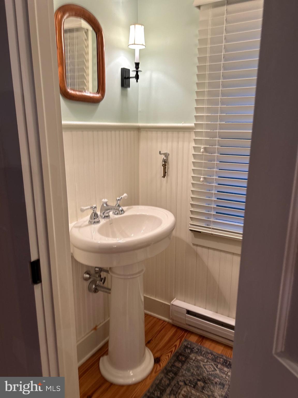 29 Chestnut Street Princeton, NJ 08542 - Photo 10 of 26 a bathroom with a sink and a mirror