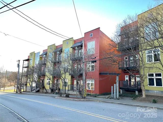a city street with tall buildings