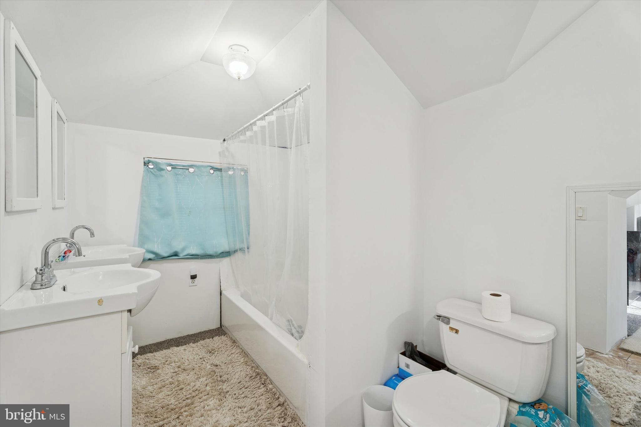 2943 East Walnut Street Colmar, PA 18915 - Photo 20 of 24 a bathroom with a sink toilet vanity and tub