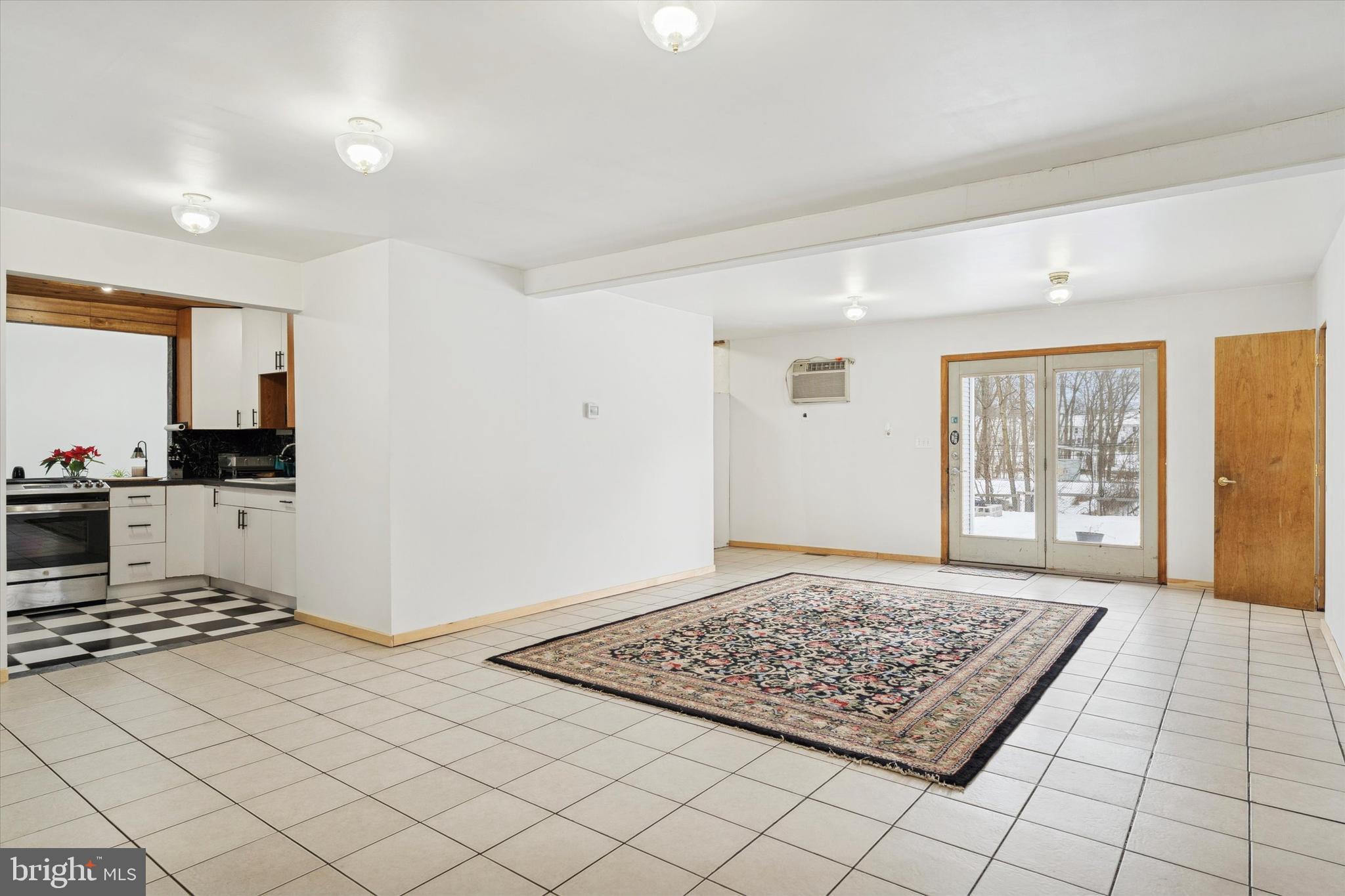 2943 East Walnut Street Colmar, PA 18915 - Photo 4 of 24 a living room with a couch and a rug