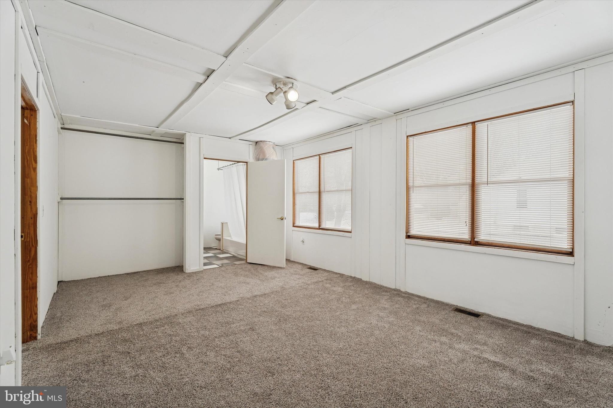 2943 East Walnut Street Colmar, PA 18915 - Photo 5 of 24 an empty room with windows and refrigerator