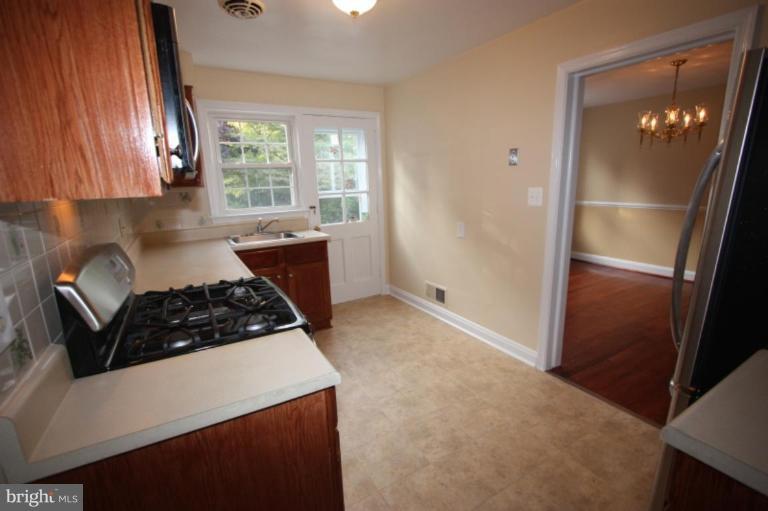 8210 Pleasant Plains Road Towson, MD 21286 - Photo 9 of 30 KITCHEN IS ADJACENT TO THE DINING ROOM