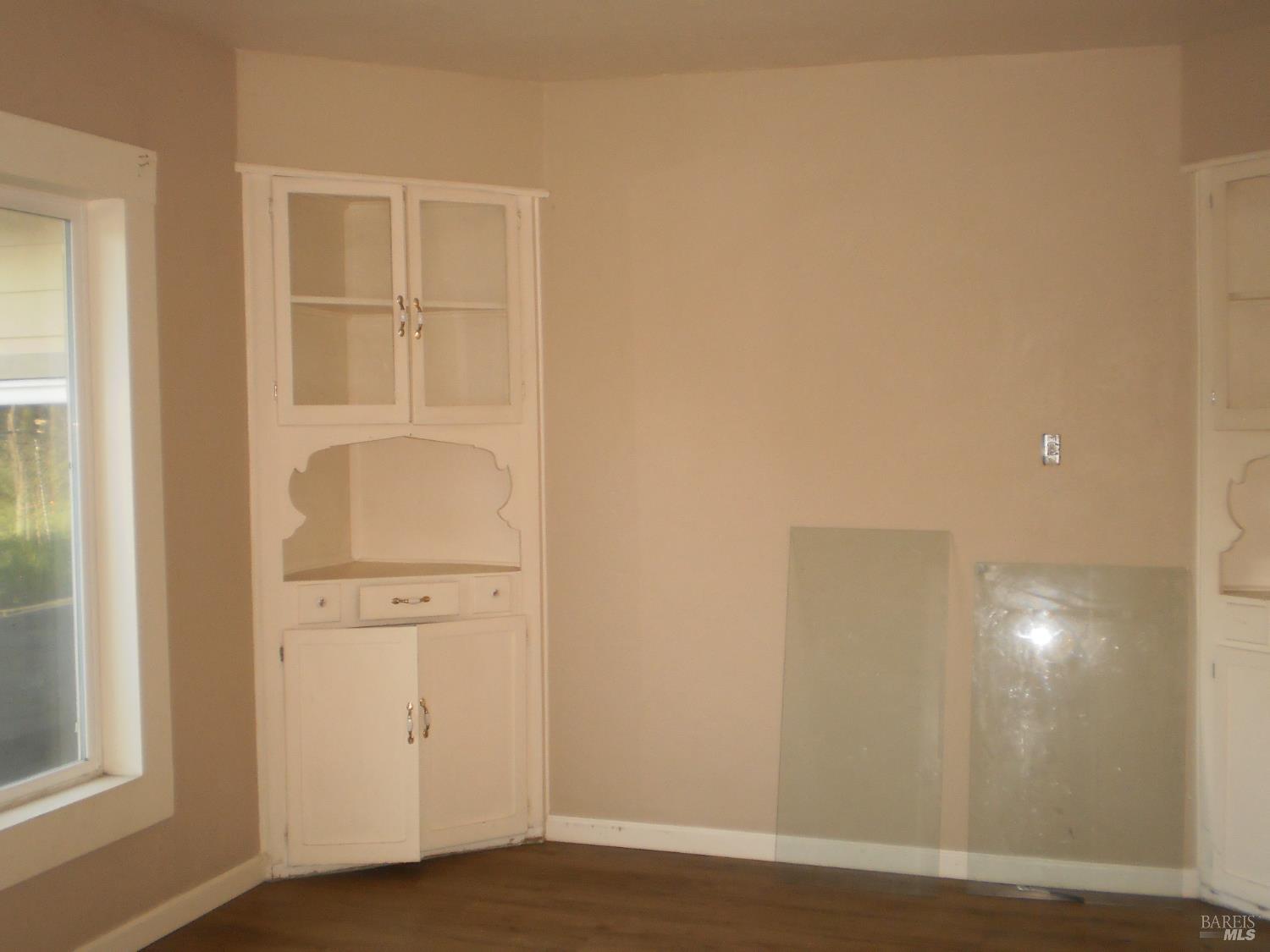 1911 Corby Avenue Santa Rosa, CA 95407 - Photo 19 of 19 an empty room with wooden floor and windows