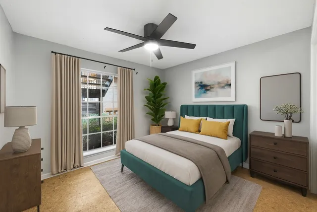 a bathroom with a granite countertop sink a mirror and a toilet