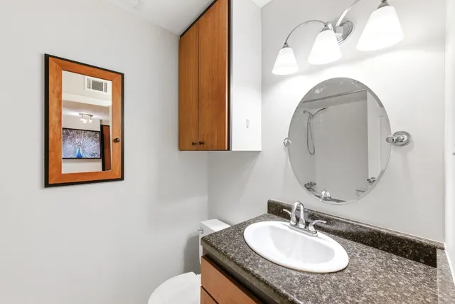 a view of a cafe with a table and chairs under an umbrella