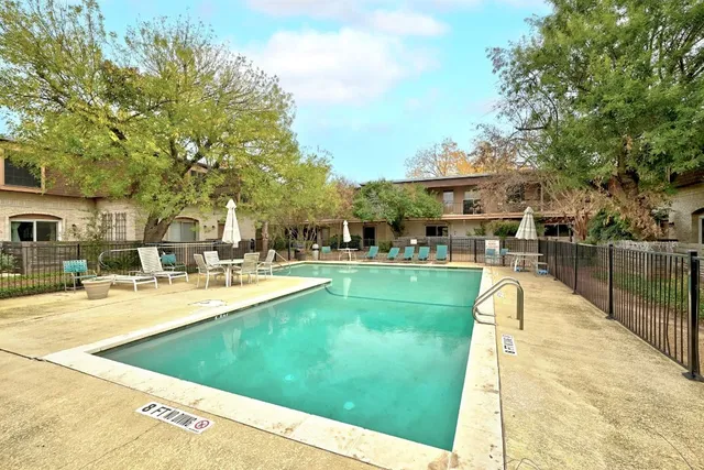 a view of a house with sitting area and garden