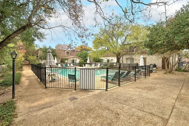 a view of a swimming pool with a patio