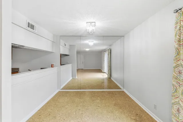 a kitchen with a sink and a refrigerator