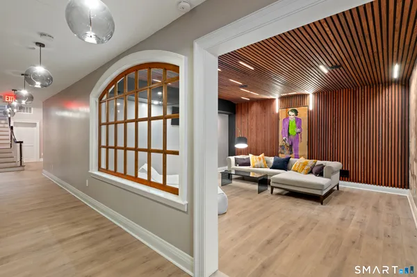 a view of hall way with furniture