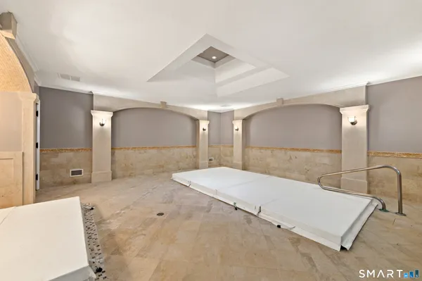 a spacious bathroom with a tub and shower