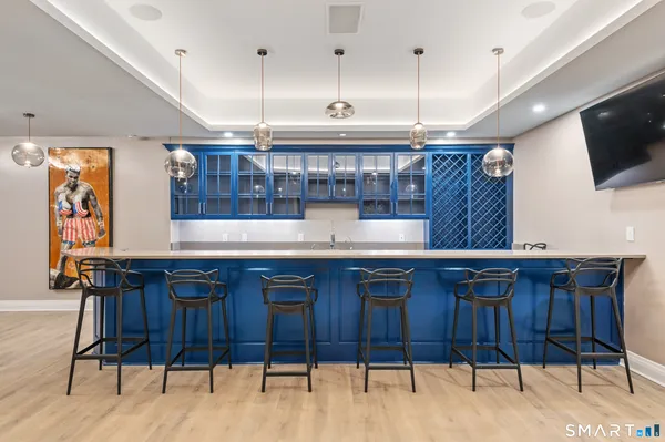 a open kitchen with stainless steel appliances granite countertop a sink and a white cabinets