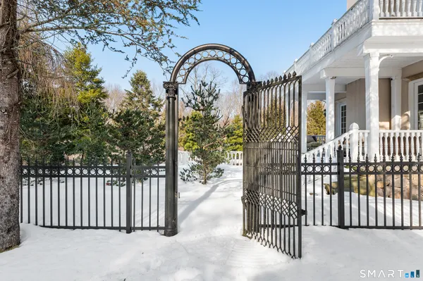 a view of a house with a iron gate