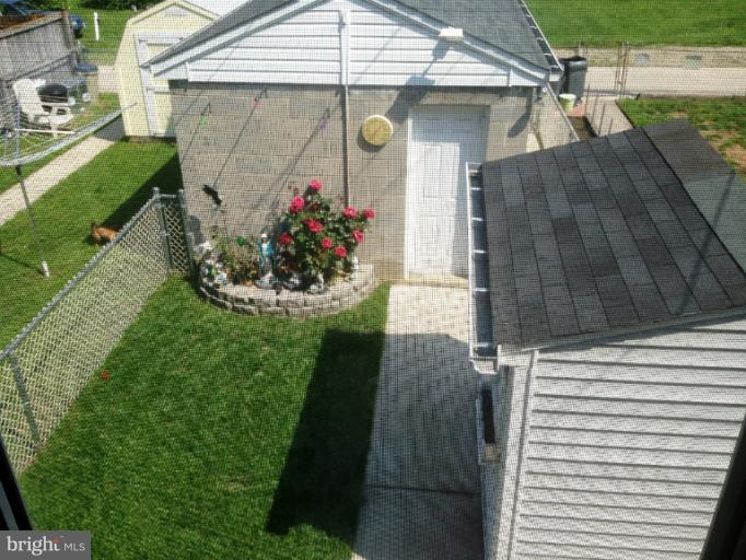 6708 Woodley Road Baltimore, MD 21222 - Photo 1 of 18 Backyard from Sunroom