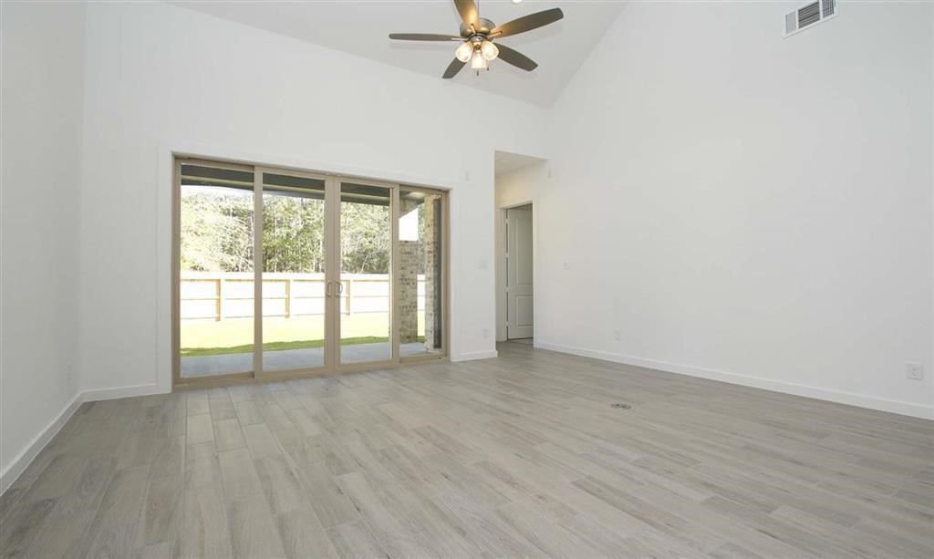 17351 Merigold Hts Drive Conroe, TX 77302 - Photo 16 of 49 a view of an empty room with a window