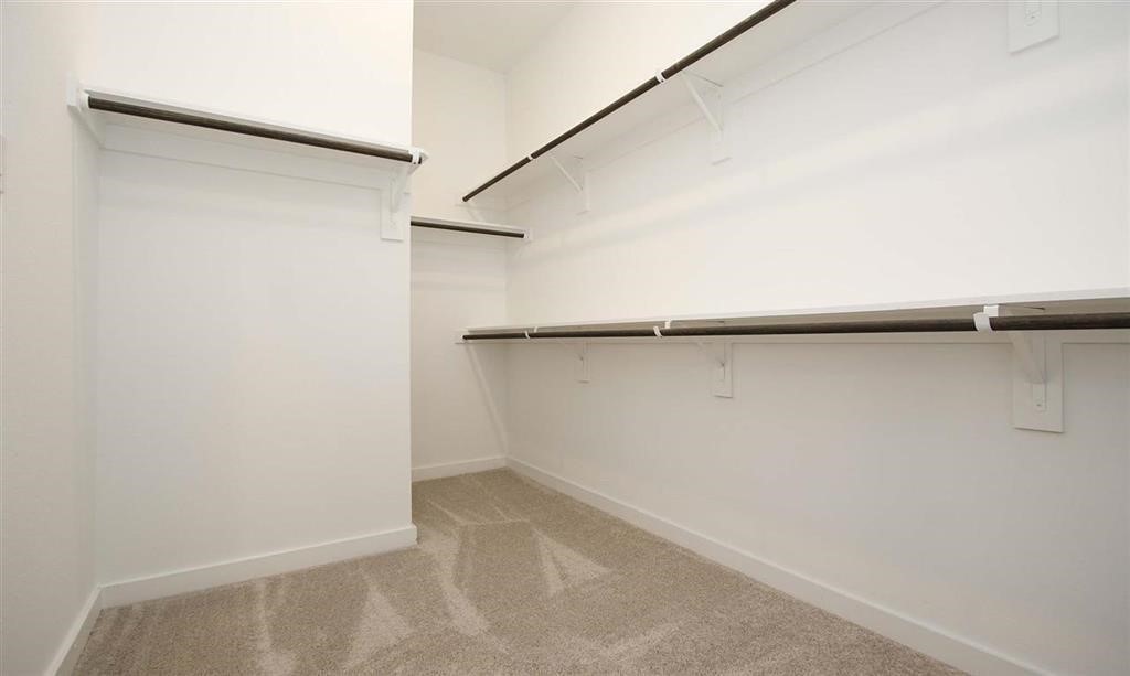 17351 Merigold Hts Drive Conroe, TX 77302 - Photo 22 of 49 a view of small space with racks on the wall
