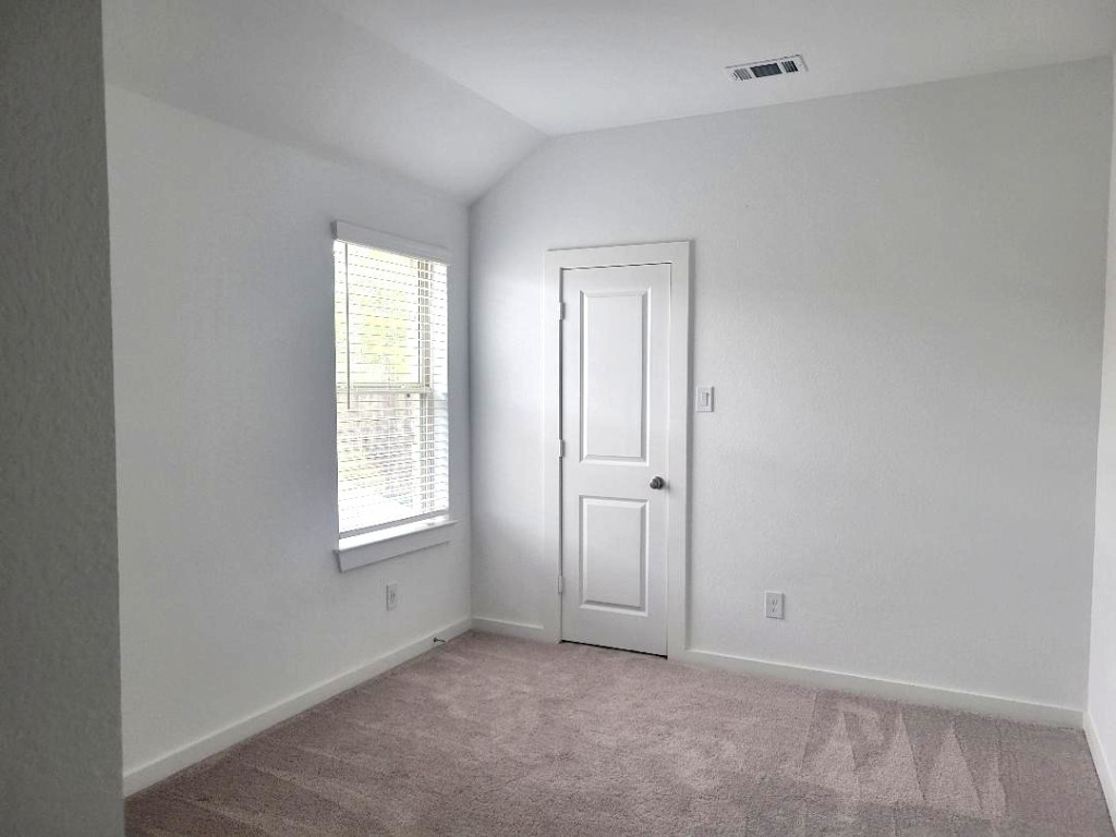 17351 Merigold Hts Drive Conroe, TX 77302 - Photo 31 of 49 an empty room with windows and closet