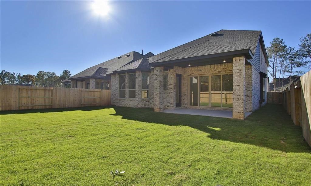 17351 Merigold Hts Drive Conroe, TX 77302 - Photo 38 of 49 a view of a back yard of the house