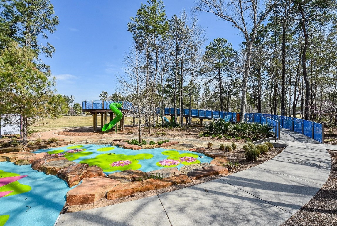 17351 Merigold Hts Drive Conroe, TX 77302 - Photo 43 of 49 a view of a swimming pool with a yard